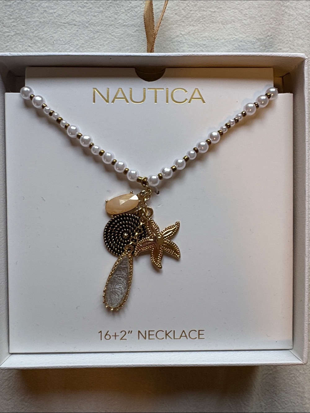 Nautica White Pearl Necklace with Gold Starfish and Shell Charms